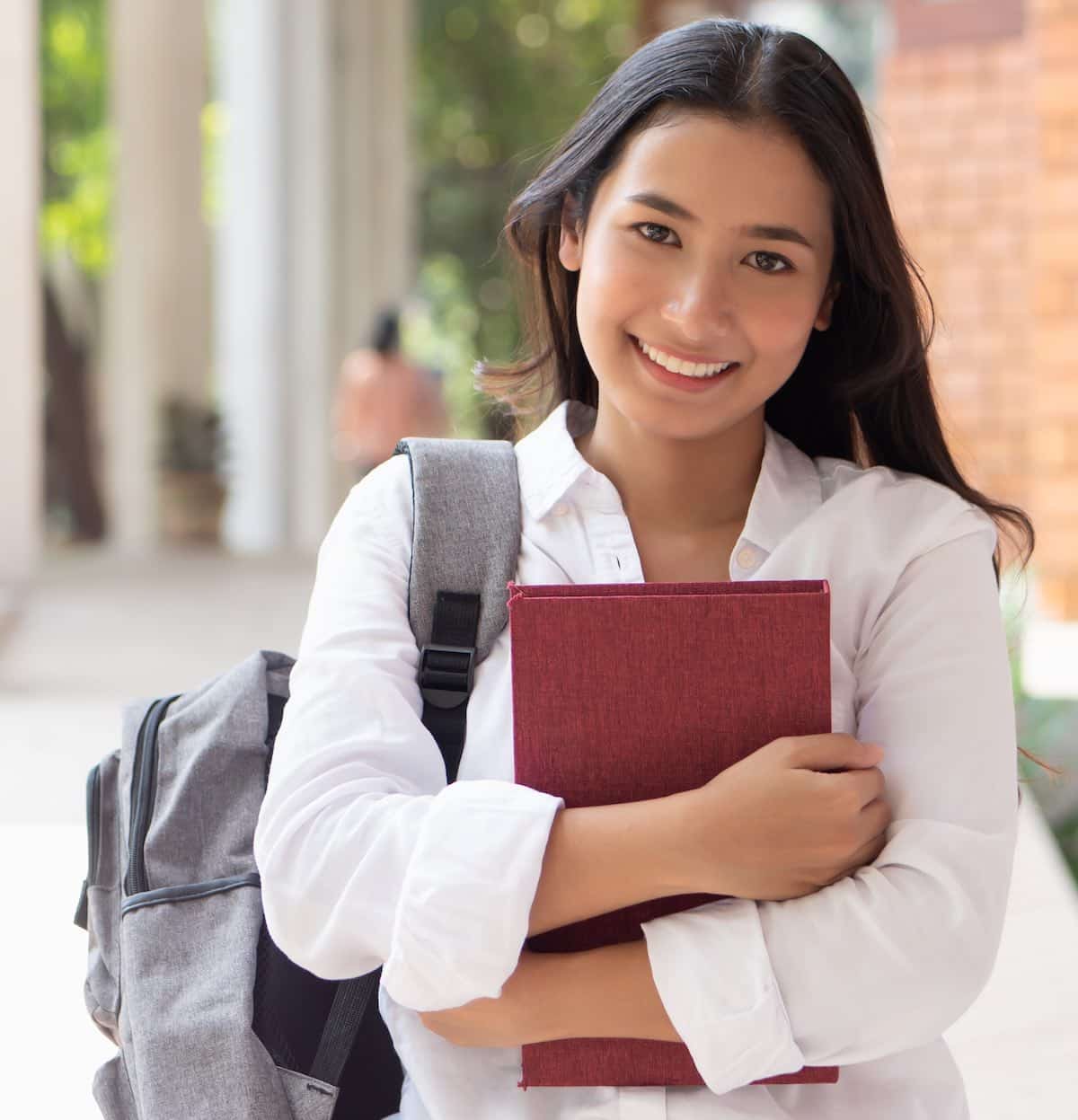 happy smiling asian woman college student